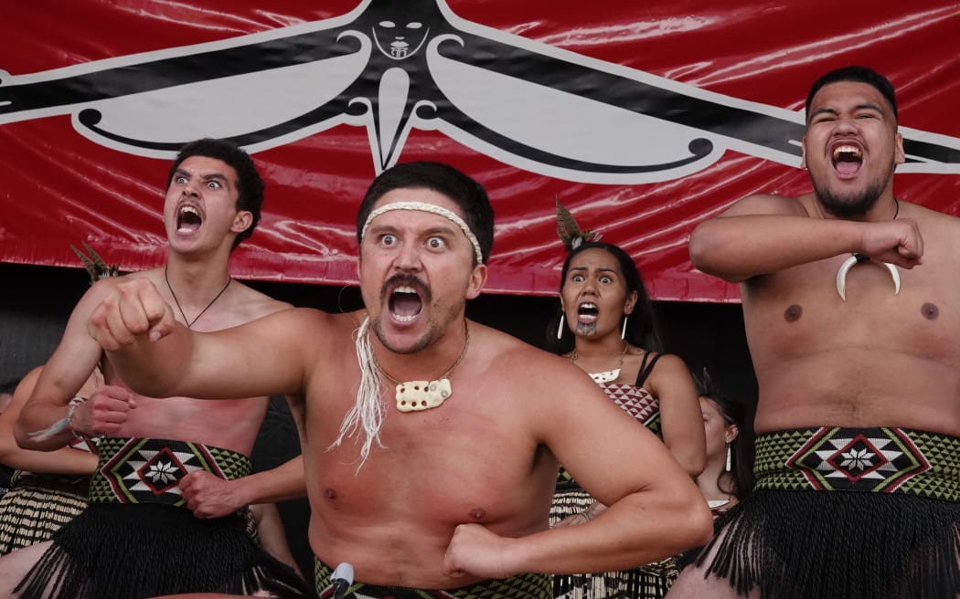 Barney Cooper peforms a haka with Hātea kapa haka.