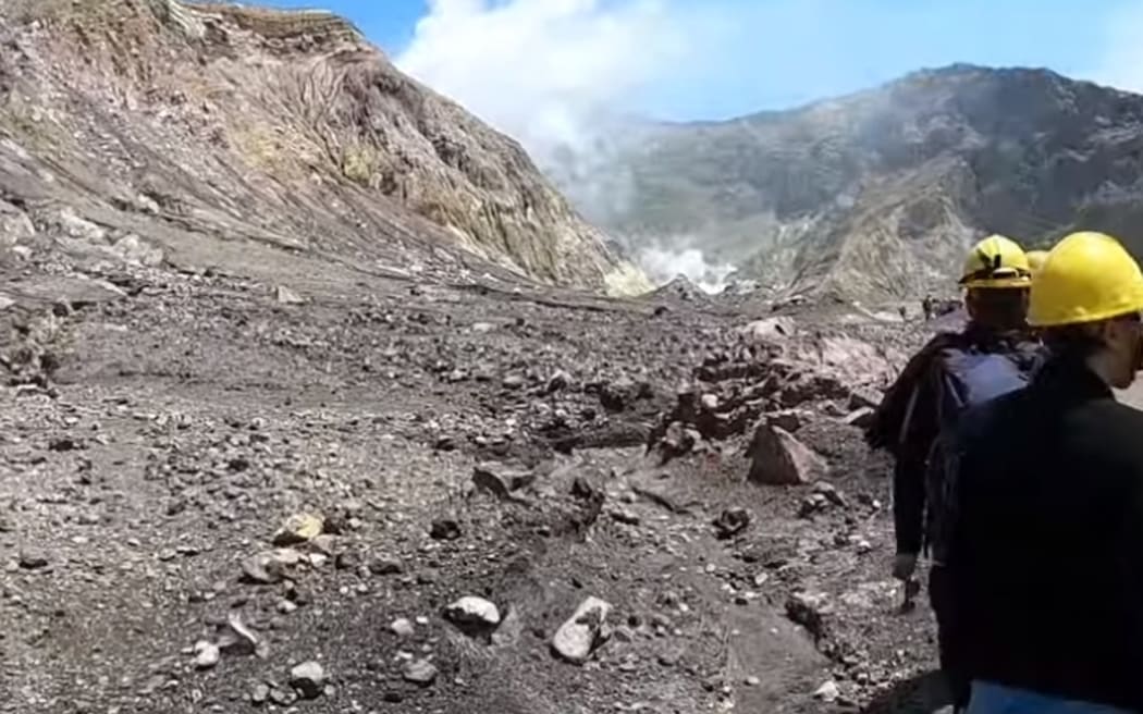 The group toured the island before finishing their trip and leaving on their boat. After they left they saw the eruption happening behind them.