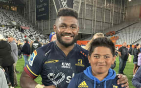 Timoci Tavatavanawai with young Fijian fan Seilala Mapusua Nabalagi at the Forsyth Barr Stadium after a Super Rugby Pacific clash this year. Photo: Supplied