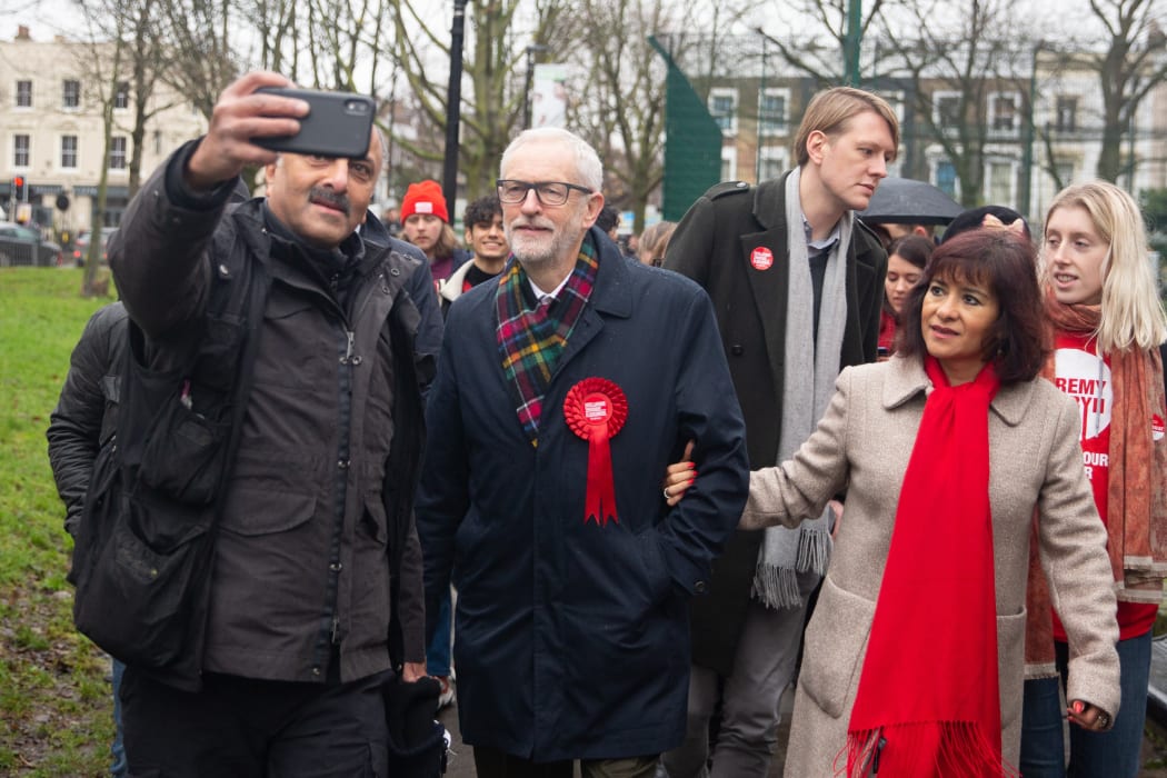 Labour Party Leader Jeremy Corbyn  and his wife Laura Alvez leave a polling station after voting.