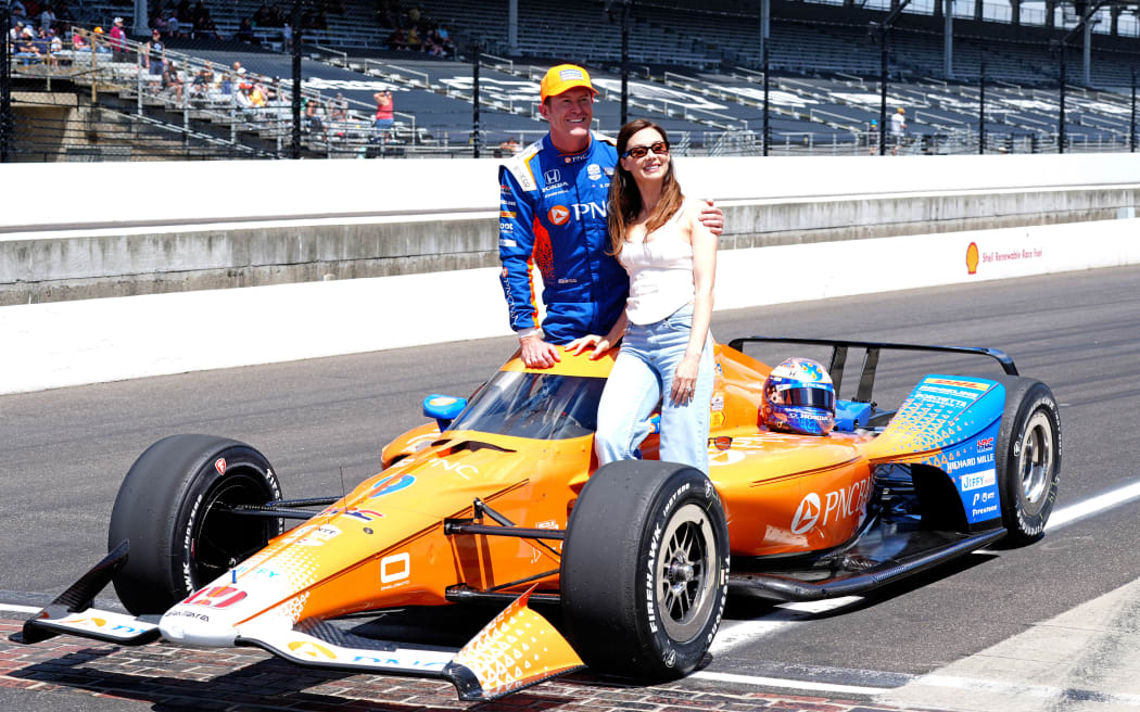 IndyCar driver Scott Dixon (9) poses for a photo with his wife Emma after qualifying for the 109th Running of the Indianapolis 500 on May 17, 2025.