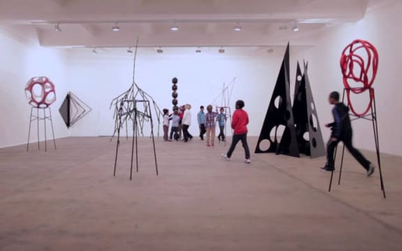 Boys and sculpture - a screen shot from an early section of Eva Rothschild's video before the sculptures are dismantled curing the course of the boys' boisterous play.