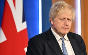 Britain's Prime Minister Boris Johnson attends a press conference in the Downing Street Briefing Room in central London on May 25, 2022, following the publication of the Sue Gray report. - UK Prime Minister Boris Johnson rejected calls to resign after an inquiry Wednesday found that he presided over a culture of lockdown-breaking parties that featured drunken fighting among staff. Johnson is among dozens of people in Downing Street who have received police fines for breaching Covid regulations since 2020 -- making Number 10 the most penalised address in the entire country. (Photo by Leon Neal / various sources / AFP)