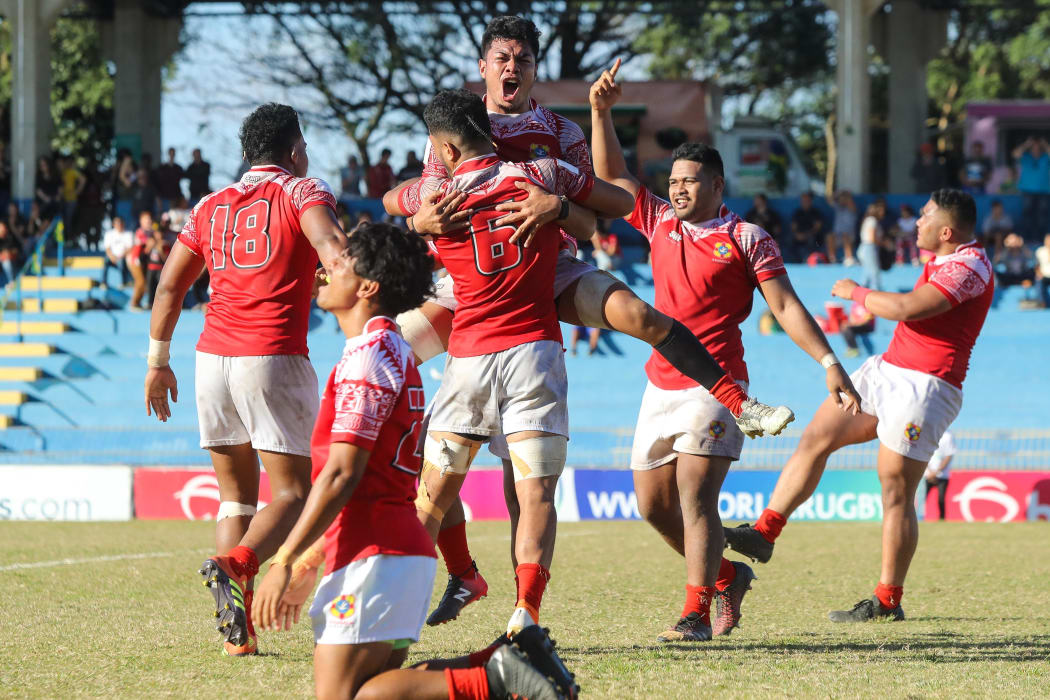 Tonga celebrate after Uruguay missed a conversion attempt with the final kick of the game.