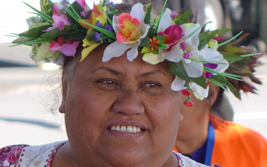 A Cook islands woman watches Constitution Day celebrations, August 2015