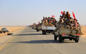 Yemeni army reinforcements arrive to join fighters loyal to Yemen's Saudi-backed government, on the southern front of Marib, the last remaining government stronghold in northern Yemen, on November 16, 2021.