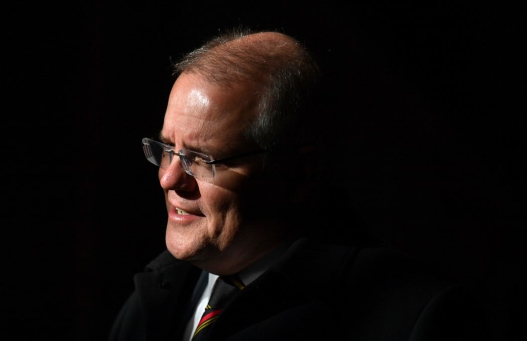 Australia's Prime Minister Scott Morrison awaits the arrival of Papua New Guinea's Prime Minister James Marape for a meeting at Parliament House in Canberra on July 22, 2019. - Marape is on a six-day visit to Australia. (Photo by MICK TSIKAS / POOL / AFP)