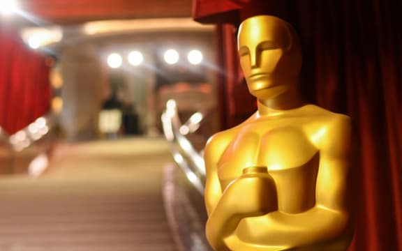 Preparations are made along the red carpet ahead of the 95th Academy Awards, in Hollywood, California, on March 11, 2023. - The red carpet for the Oscars airing on March 12, 2023, is champagne-color for 2023. (Photo by Valerie Macon / AFP)