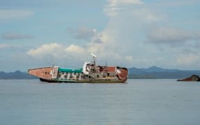 Fishing vessel El Samaurai was driven onto a reef in Suva harbor during tropical cyclone Sarai in 2019 and remains aground. Pictured on Feb 14, 2025. (Harry Pearl/Benar News)