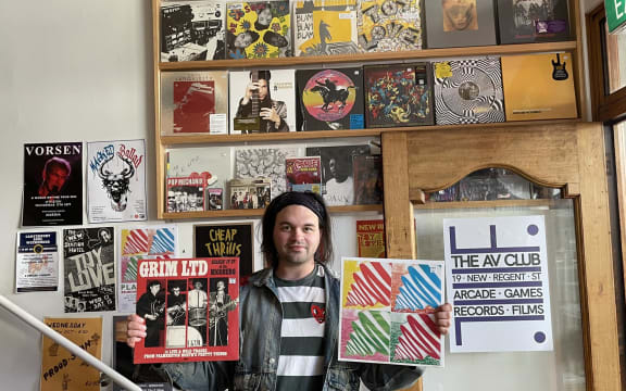 Matthias McGregor in The AV Club (holding Grim Ltd. and Playthings LPs)