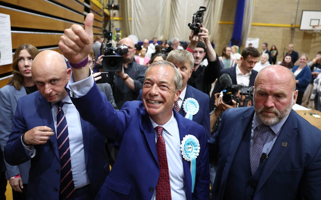 Farage, center, celebrates after being elected the member of parliament for Clacton in eastern England, on July 5, 2024.