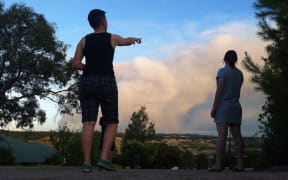 People watch a bushfire at Humbug Scrub near Kersbrook, north-east of Adelaide.