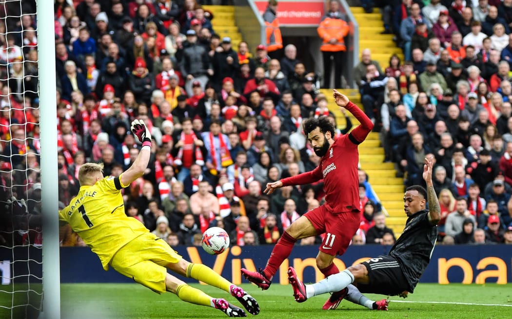 Mohamed Salah scores for Liverpool against Arsenal.