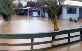 The Reweti whānau home during flooding in 2015.