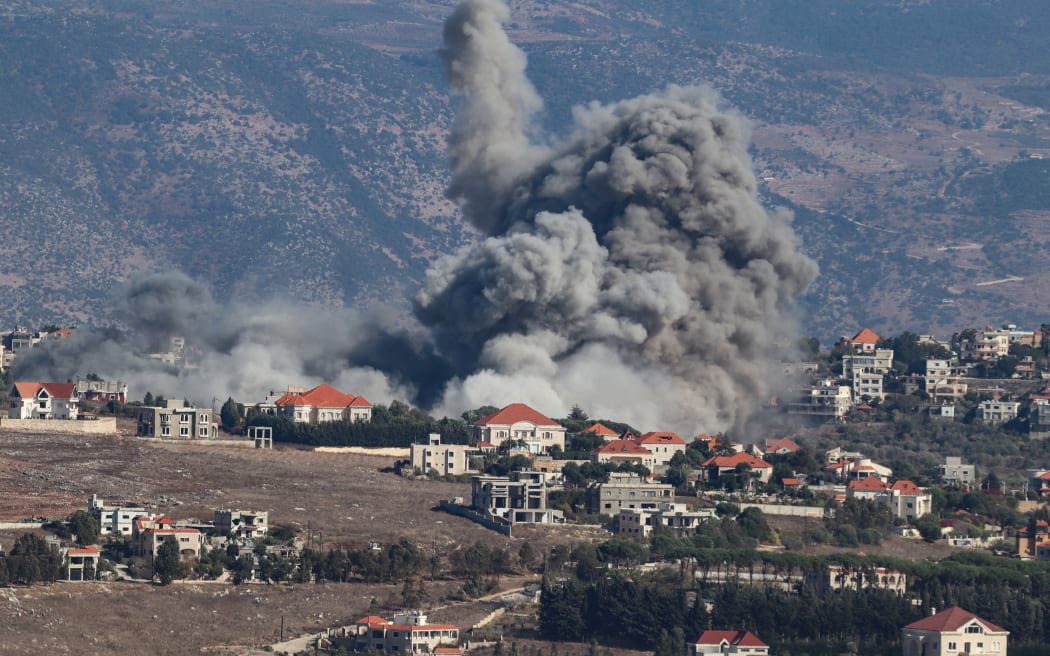 Smoke rises from the site of an Israeli airstrike that targeted the southern Lebanese village of Khiam on September 25, 2024. Lebanon said 23 people were killed and dozens injured in Israeli strikes across Lebanon September 25, the third day of major Israeli raids in the country as fighting with Hezbollah has intensified. (Photo by Rabih DAHER / AFP)