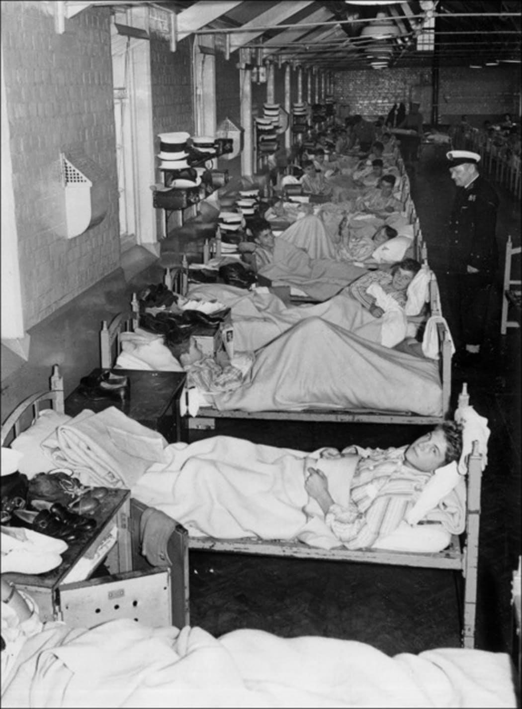 British navy soldiers in a makeshift infirmary in an Ipswich warehouse  - Sept 19 1957