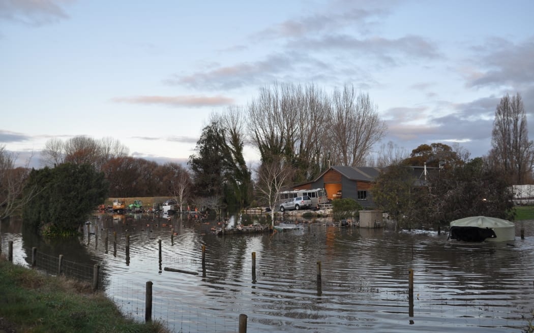 Pouesi and Hilary Fitisemanu's Riwaka home surrounded by floodwater from the Motueka River.