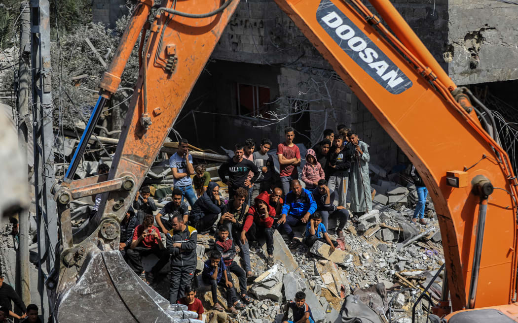 Search and rescue teams gathered to save people from a collapsed building in Rafah, Gaza on 2 April, 2024.