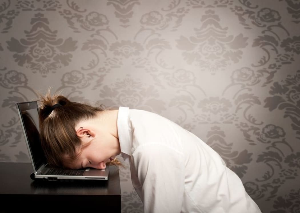 tired lady at computer