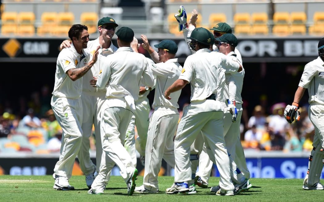 Mitchell Johnson and the Australian team celebrate the wicket of BJ Watling on day 3, 7 November 2015. New Zealand tour of Australia, 1st test at Brisbane 5-9 November 2015. Copyright photo: www.photosport.nz