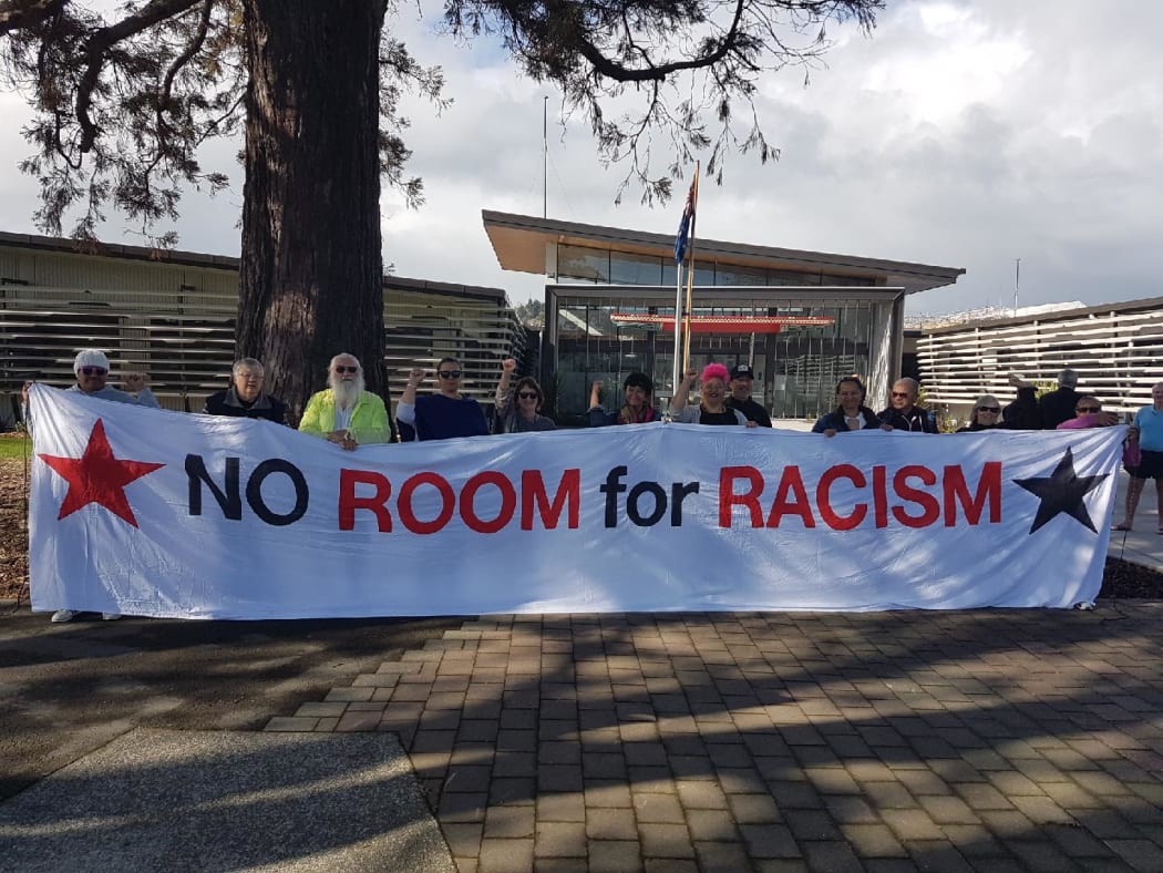 Protesters outside the Gisborne District Council want to make sure the conversation doesn't die down.