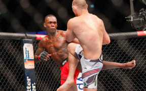 Israel Adesanya and Sean Strickland in action at UFC 293 in Sydney.