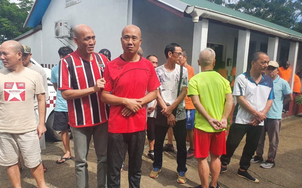Chinese nationals outside the Supreme Court in Port Vila