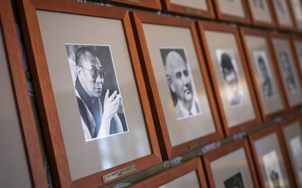 This photo taken on September 25, 2024 shows a portrait of the Dalai Lama, Nobel Peace Prize laureate of 1989, next to other photographs of laureates on a wall of the committee meeting room at the Norwegian Nobel Institute in Oslo, Norway. The 2024 Nobel Prize announcements will take place from October 7-14. The winner of the Nobel Peace Prize will be announced in Oslo on October 11. (Photo by Jonathan NACKSTRAND / AFP)