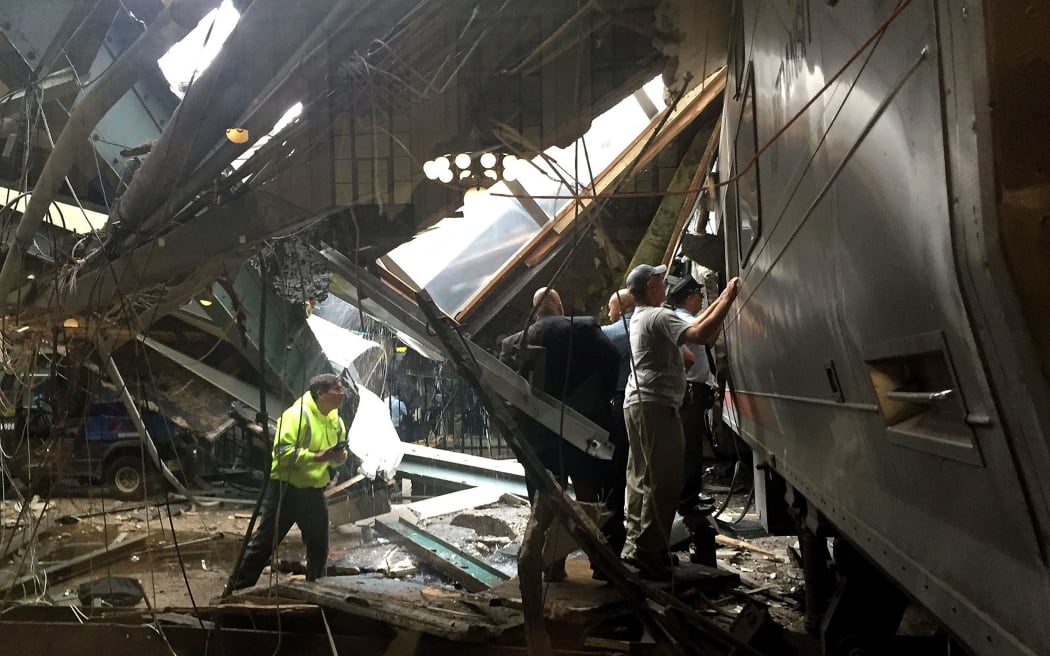 The scene after the commuter train crashed in to the platform at the Hoboken Terminal.