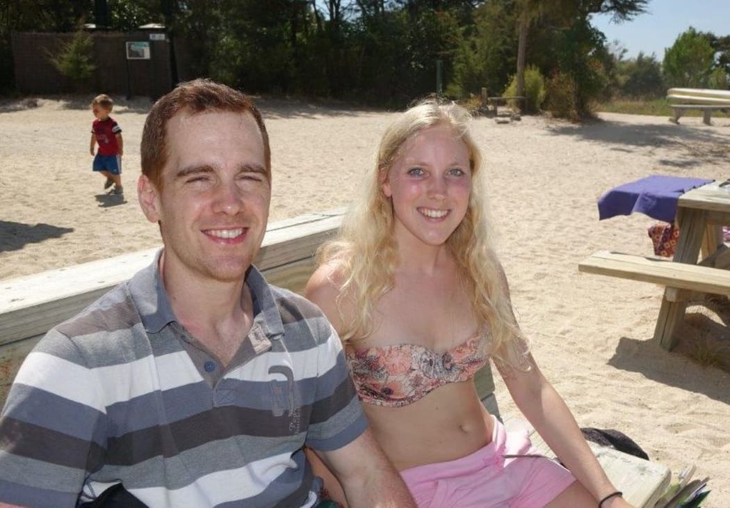 Tourists Sebastiaan de Bruin and Annika Vanlaerhoven enjoing a picnic lunch while swatting wasps at the Torrent Bay lagoon, Abel Tasman National Park.