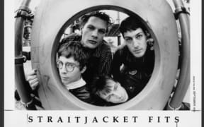 A black and white portrait of the band Straitjacket Fits.