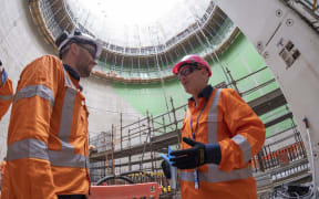 Watercare Central Interceptor lead engineer Bojan Jovanovic talks to chief executive Jon Lamonte in an underground shaft where the project's first stage of tunnelling from Māngere to Mount Roskill started in July.
