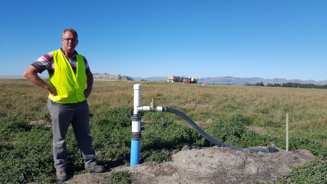 Christchurch City Council's landfill aftercare officer, Grant Gillard, checks out one of the current gas wells at the Burwood Landfill site.