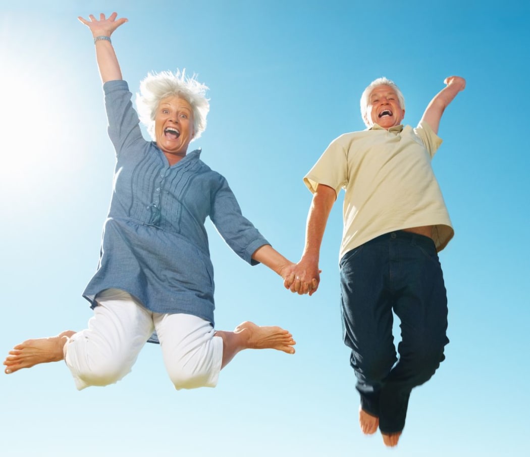 Senior couple jumping