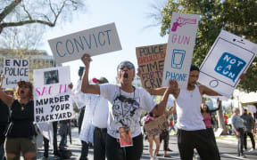 Black Lives Matter protesters march through the streets in response to the police shooting of Stephon Clark.