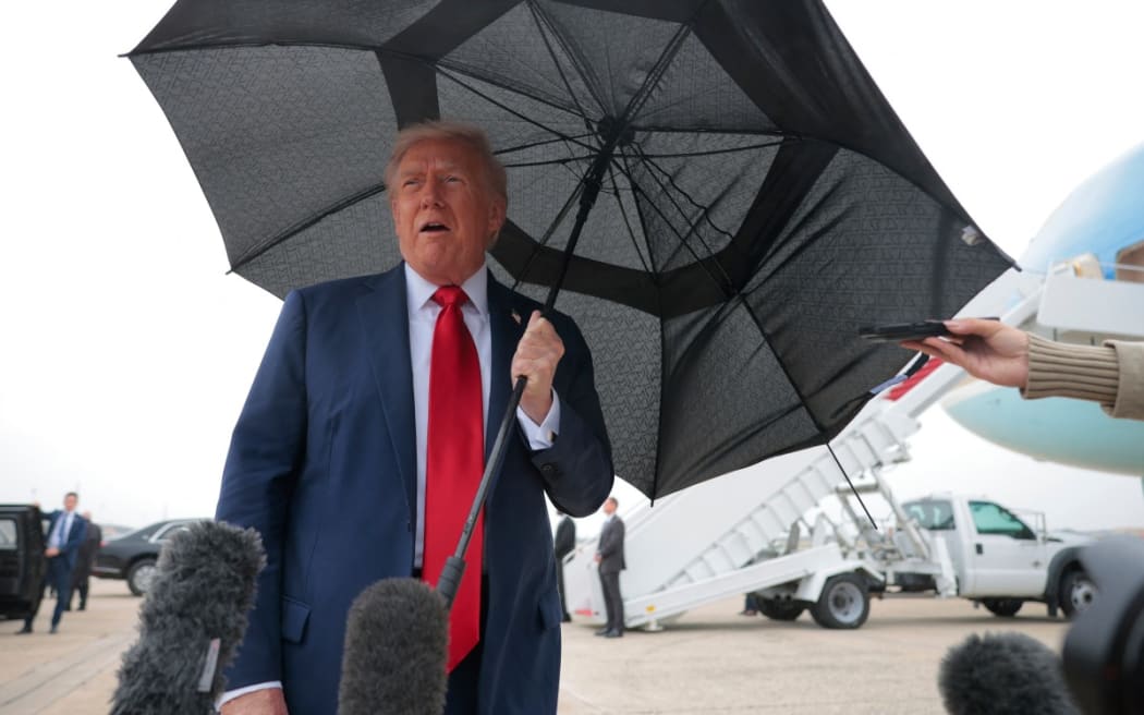 US President Donald Trump speaks to the press before boarding Air Force One for a trip to the Middle East on 12 October 2025 at Joint Base Andrews, Maryland.