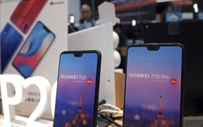 Huawei's mobile phones are displayed at a telecoms service shop in Hong Kong, Friday, March 29, 2019.