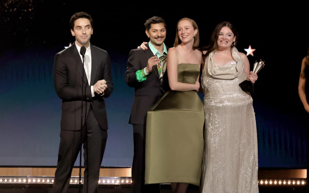 (From left) Paul W. Downs, Mark Indelicato, Hannah Einbinder and Megan Stalter accept the Best Comedy Series award for "Hacks" onstage during the 30th Annual Critics Choice Awards at Barker Hangar on February 07, 2025 in Santa Monica, California.