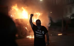 Fires burn around downtown Wisconsin during a second night of rioting