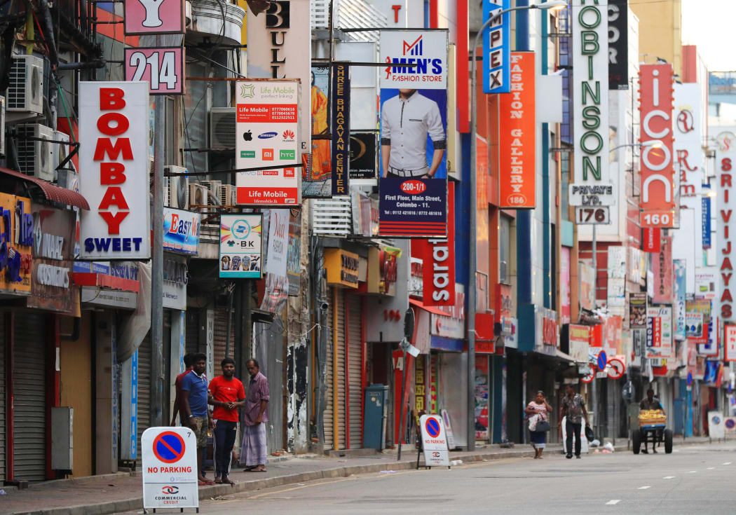 Almost shops close at a local shopping street in Colombo City, Sri Lanka on April 22, 2019, a day after the hotel and churches were hit in series of bomb blasts. Police officers have inspected the interior of the church. At least 290 people died due to the series of bombings as of April 22.