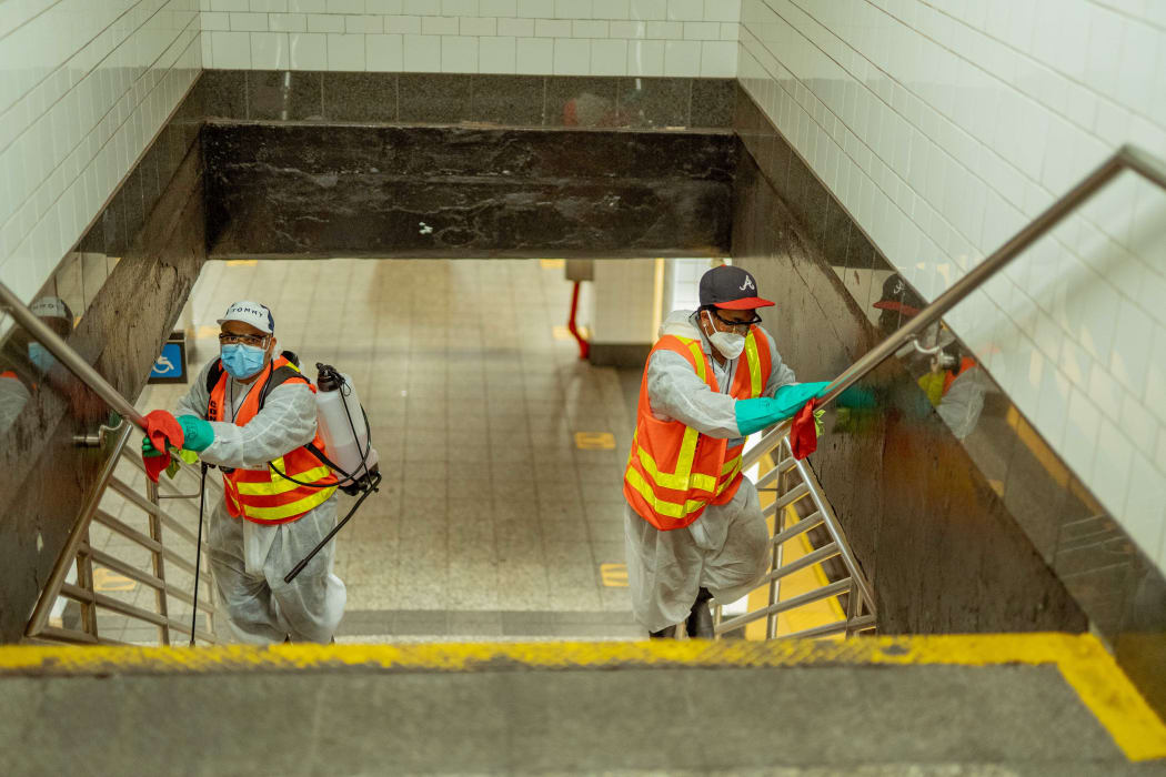 New York Subway MTA officials are seen cleaning and disinfecting during the coronavirus Covid-19 pandemic in the United States on June 8, 2020.