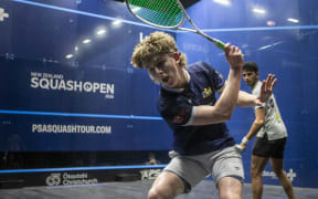 Ollie Dunbar in action against Velavan Senthilkumar at the New Zealand Squash Open.