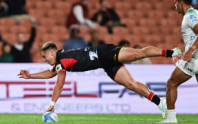 Cortez Ratima scores during the Super Rugby Pacific round 4 match between the Chiefs and Fijian Drua at FMG Stadium in Hamilton.