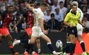 England's fly-half Owen Farrell scores a drop goal during the France 2023 Rugby World Cup quarter-final match between England and Fiji at the Velodrome stadium in Marseille, south-eastern France, on October 15, 2023.