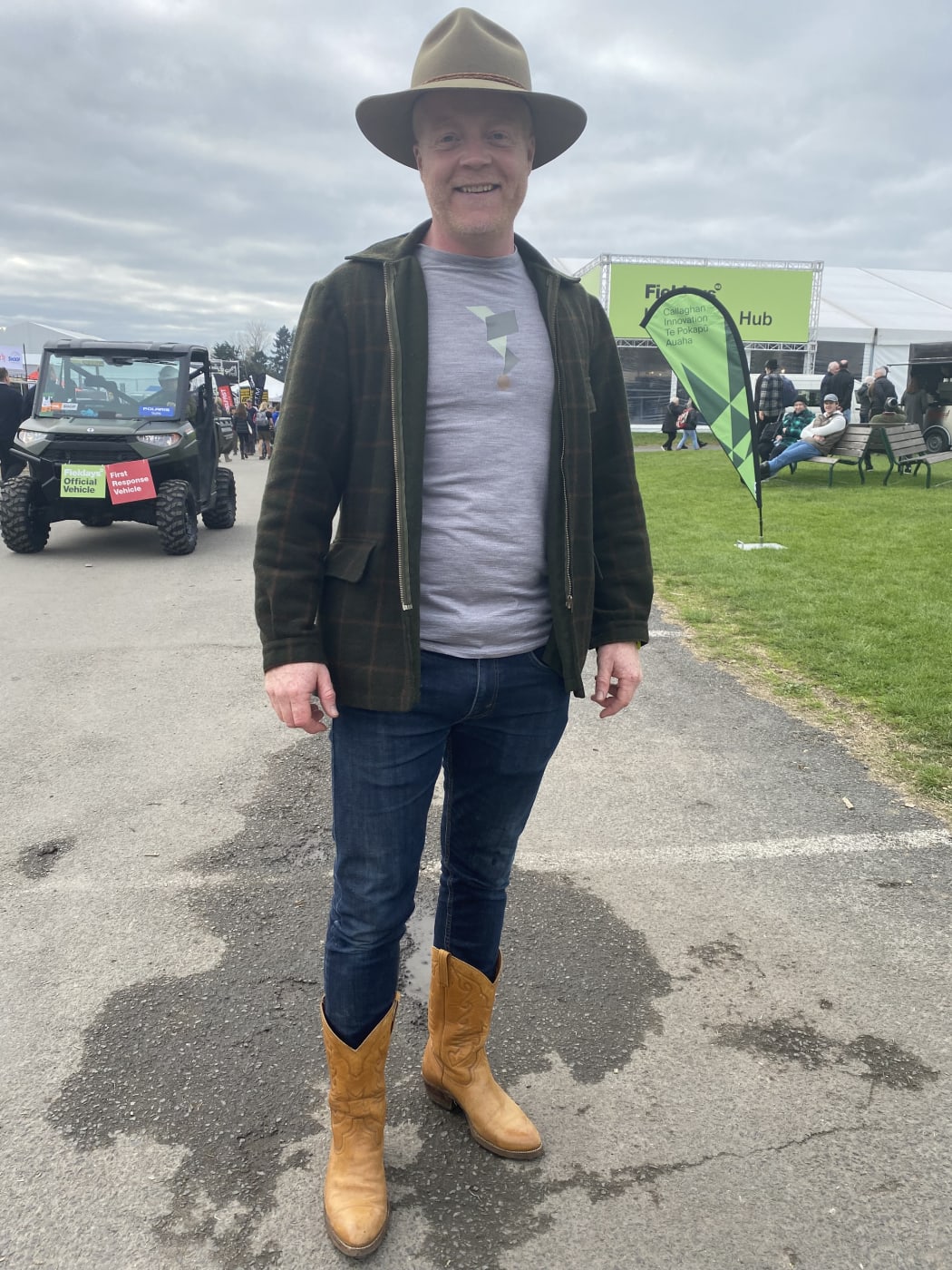 Logan is wearing grandfather's Swandri and 10-year-old cowboy boots and fielddays hat. He comes here every year to see what’s new.