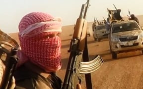 An image taken from a video uploaded by ISIS allegedly shows them driving in vehicles near the central Iraqi city of Tikrit.