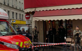 French police and Vigipirate secure the street after several shots were fired along rue d'Enghien in the 10th arrondissement, in Paris.
