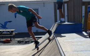 A skater in the current skate park.