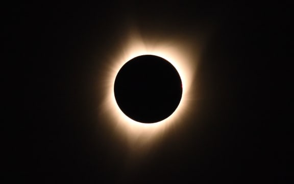 The sun's corona is visible as the moon passes in front of the sun during a total solar eclipse at Big Summit Prairie ranch in Oregon's Ochoco National Forest.