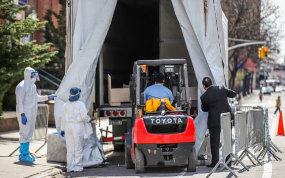 A refrigerated try with a frigurific truck is used as a morgue at The Brooklyn Hospital Center in New York during the coronavirus Covid-19 pandemic in the United States.